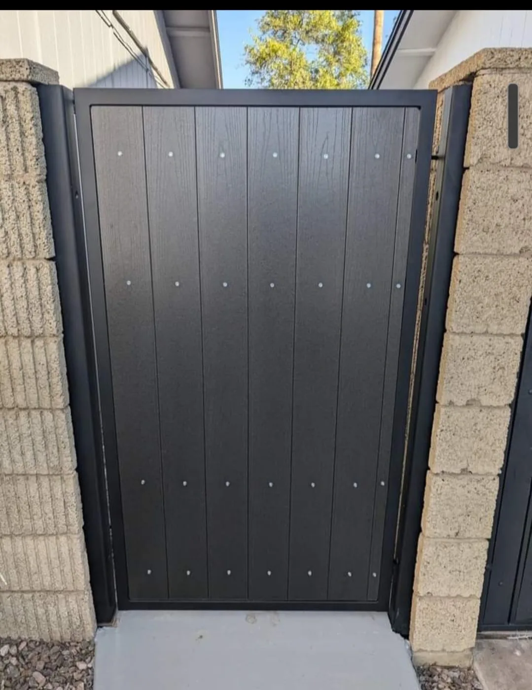 Black security door fabricated to fit